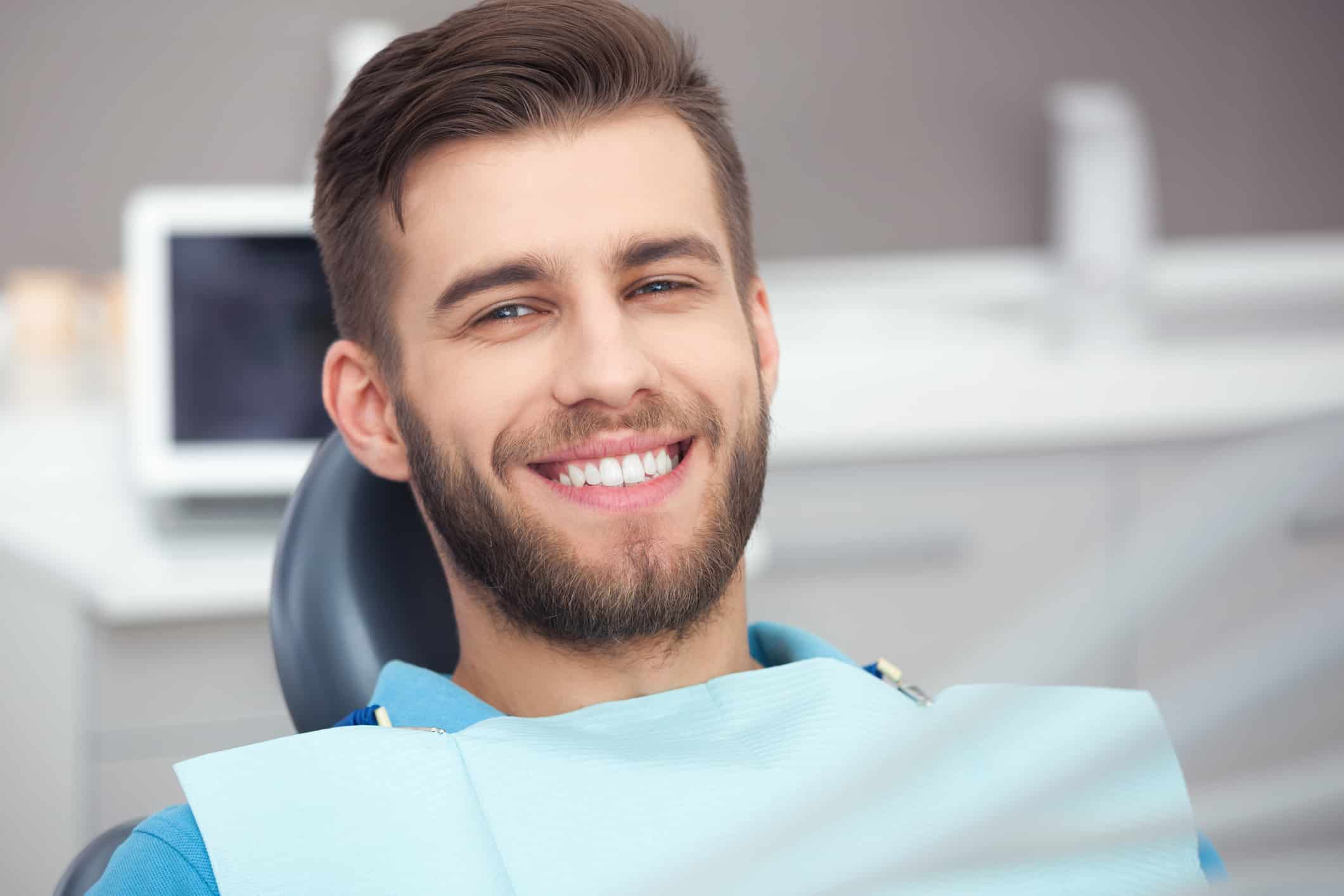 Smiling man in dental chair